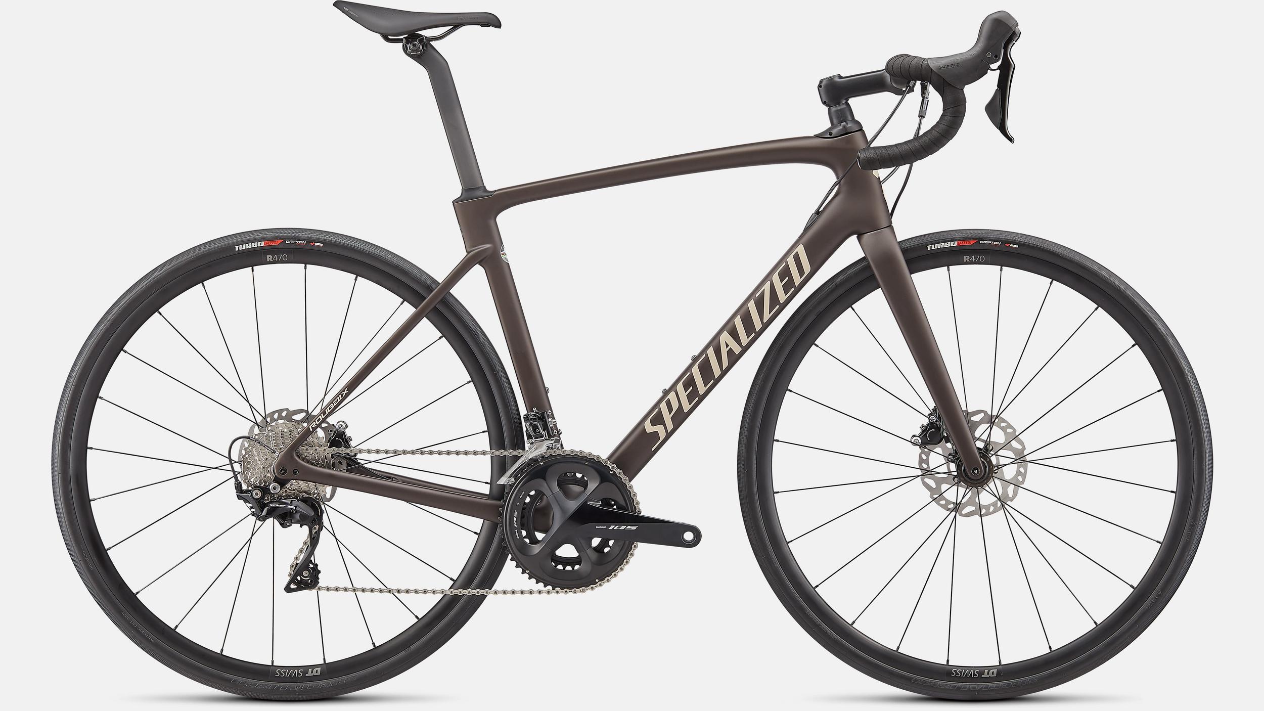 Brown Specialized Roubaix Sport carbon endurance road bike with Shimano 105 groupset and hydraulic disc brakes.