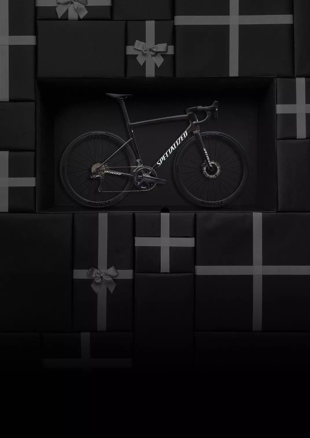 An electric bike, set into a back ground of red gift wrapped boxes.